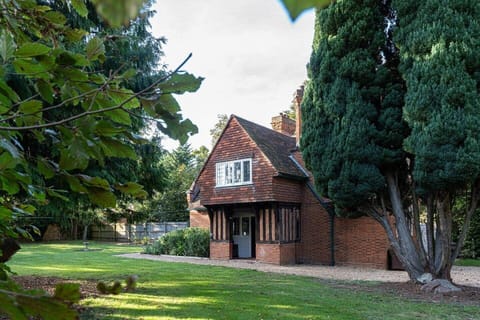 Front of cottage surrounded by its own private garden
