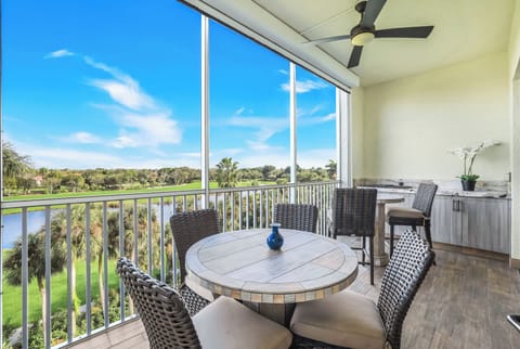 Screened lanai with golf and lake views