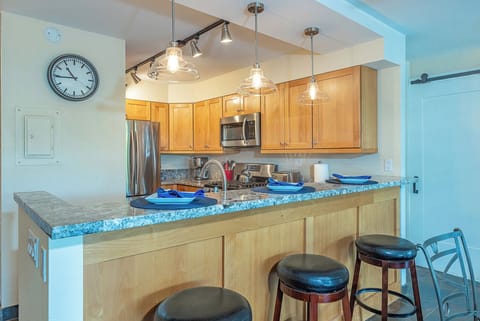 Gather around the kitchen bar for casual meals and conversation