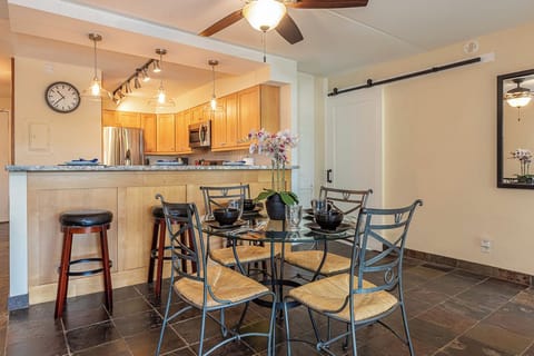 Warm gatherings start at this dining table with the kitchen close by
