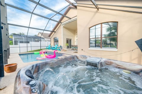 Private screened pool and jacuzzi offering a peaceful space
