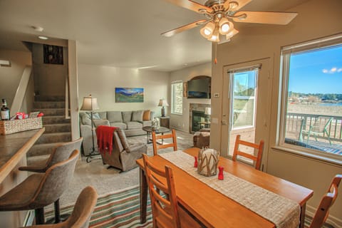 Bright, cozy space with fireplace, plush sofa, and room to relax