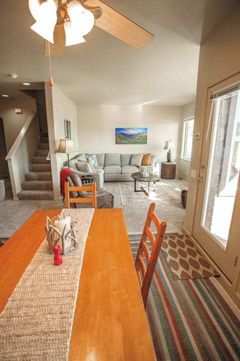 Modern comfort: roomy living area, dining table for four, and easy outdoor access.