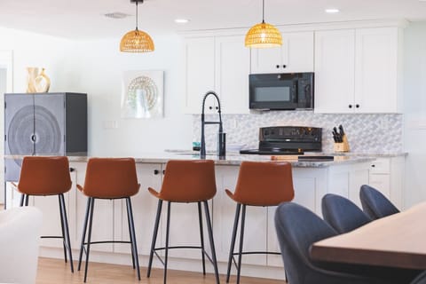 Spacious kitchen island with stylish seating — ideal for casual dining, meal prep, or gathering with the group.