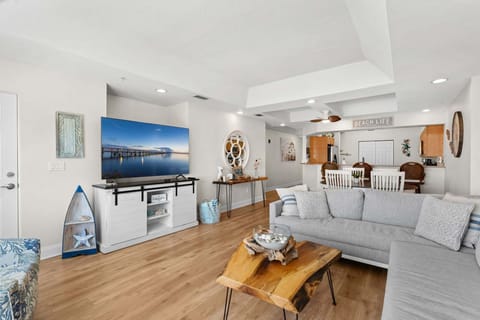 Bright & airy living room with sliding glass doors the lead to private balcony