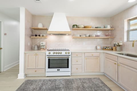 Oven, Range, and Hood alongside a fully stocked Kitchen