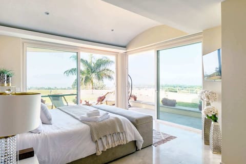 Master Bedroom |  opens to a private balcony, filling the space with natural light and lake view