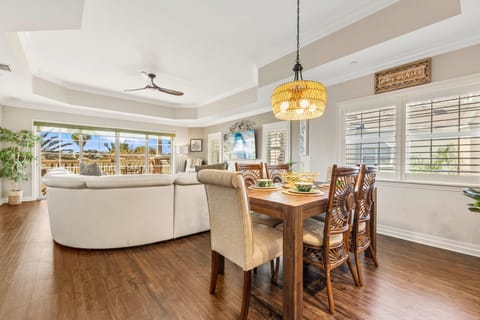 Modern dining space with warm wood-style floors — perfect for family meals.