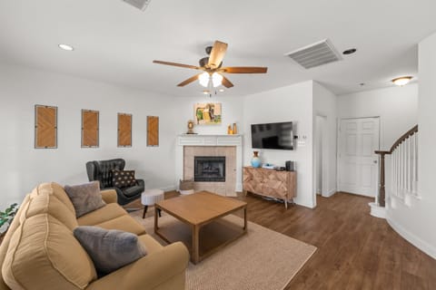 Warm, inviting room with soft seating and a wood-burning fireplace—perfect for unwinding.