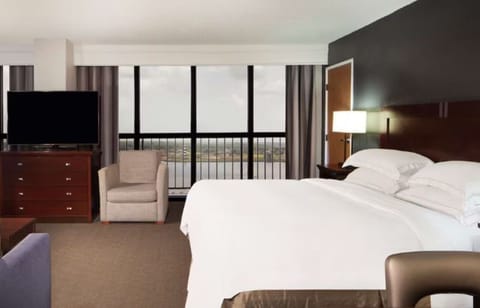 Sink into crisp linens and wake to skyline views.