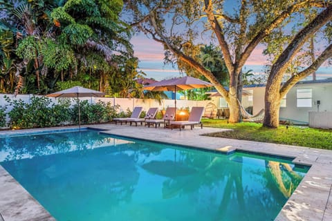 Backyard oasis with private pool and outdoor seating 