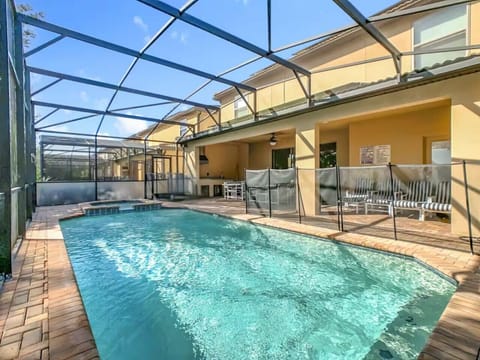 Private screened pool with outdoor seating.