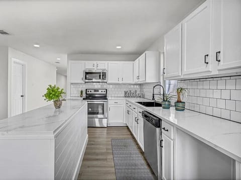 Modern, spacious, and clean kitchen designed for comfortable meal prep.