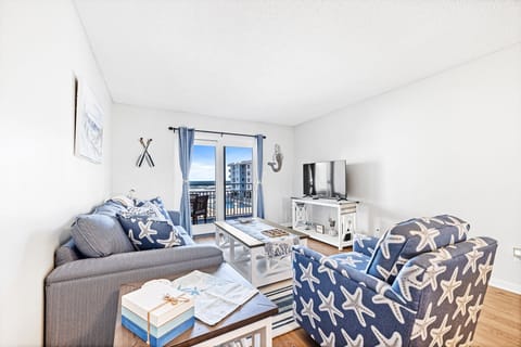 Charming and spacious living room with balcony access.