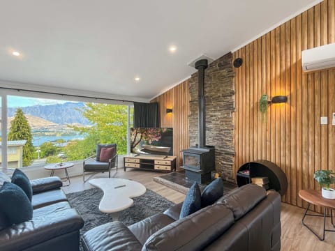 Cozy up by the fire with incredible Queenstown views right outside.
