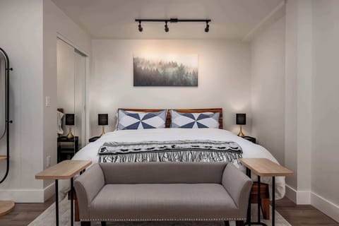 Sitting bench in front of bed
