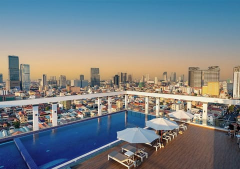 Outdoor pool, open 6:00 AM to 9:00 PM, pool umbrellas