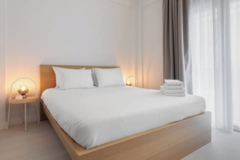 Apartment, 3 Bedrooms, Balcony, City View | Desk, laptop workspace, blackout drapes, iron/ironing board