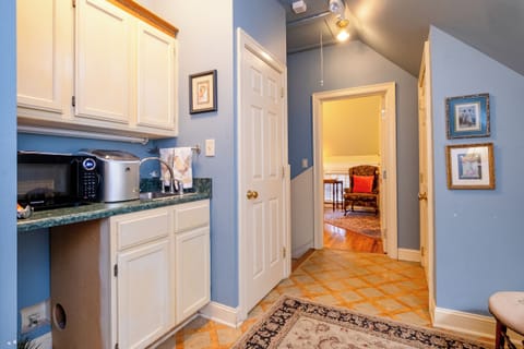 Shared guest area just outside the Garden Spa Suite, offering convenient access to a kitchenette and additional amenities.