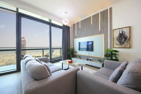 Deluxe Apartment, Balcony, City View | Living area | 64-inch LED TV with digital channels