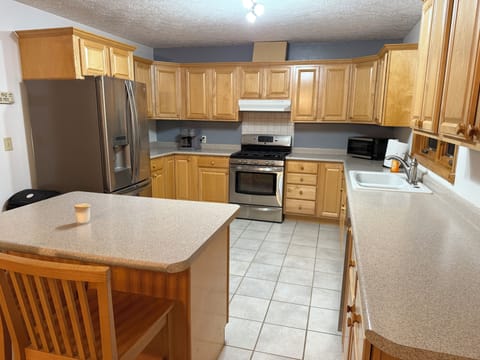 Fully stocked Kitchen with island for gathering!