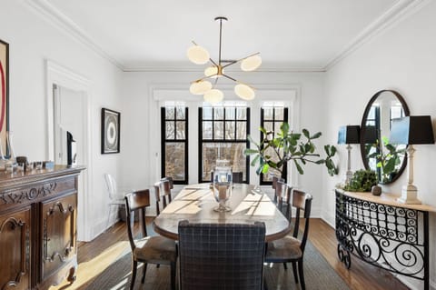 Dining Room: Perfect for longer stays—this inviting dining room is ideal for shared meals, workdays, or evening conversations, just minutes from downtown conveniences.