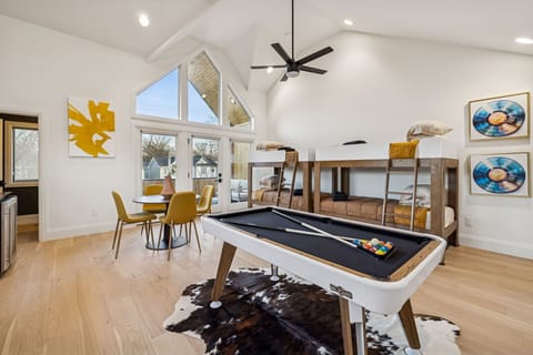 Game loft: Bring the whole crew together in this modern game loft—complete with a pool table, lounge seating, and cozy bunk beds made for late-night fun.