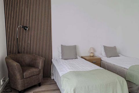 Overlooking the sleeping area where the two single beds can be combined into a double bed.