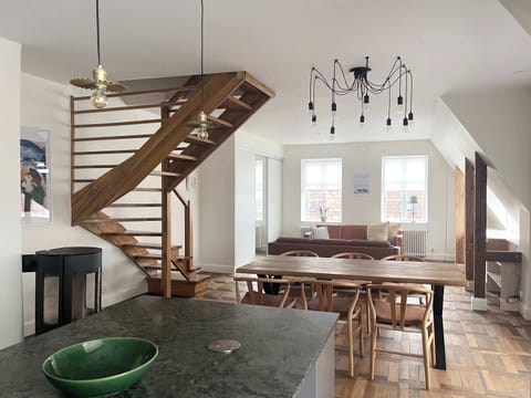 Overview of the living room and dining table on the lower level.
