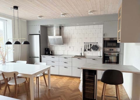 The fully equipped kitchen with all essentials you will need for a home cooked meal. There is a stove, oven, dishwasher, fridge, freezer, wine fridge, microwave, kettle and coffee maker. 