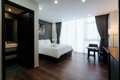 Deluxe Double Room Single Use, City View | Minibar (free items), in-room safe, desk, laptop workspace