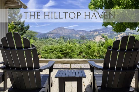 Unwind on the scenic deck with cozy chairs, fire table, and sweeping valley views—ideal for coffee at sunrise or relaxed evenings outdoors.