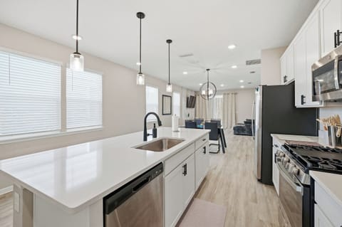 Full view of the kitchen into the living area.