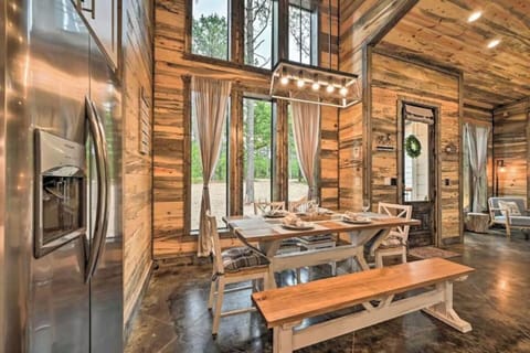 DINING ROOM -  Bright space with floor-to-ceiling windows and forest views.