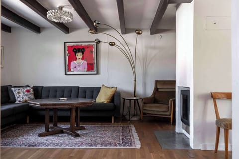 The living room with an open fireplace.