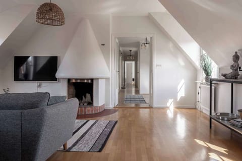 The living room, a cozy spot to relax and enjoy your favorite shows on TV.