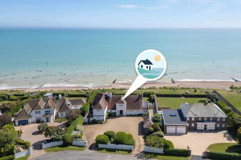 Welcome to this stunning beachfront home with direct beach access.