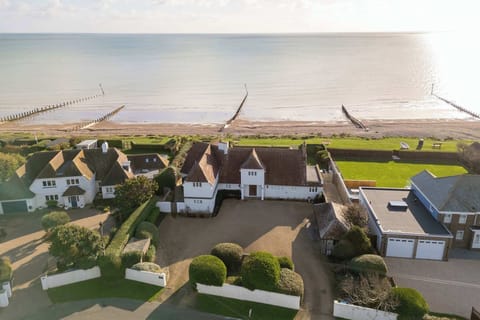 Welcome to this stunning beachfront home with direct beach access.