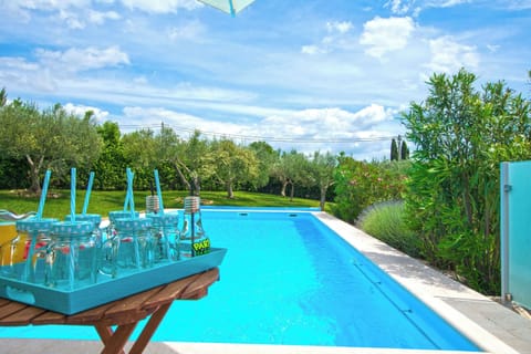 Outdoor pool, a heated pool, open open 24 hours, pool umbrellas