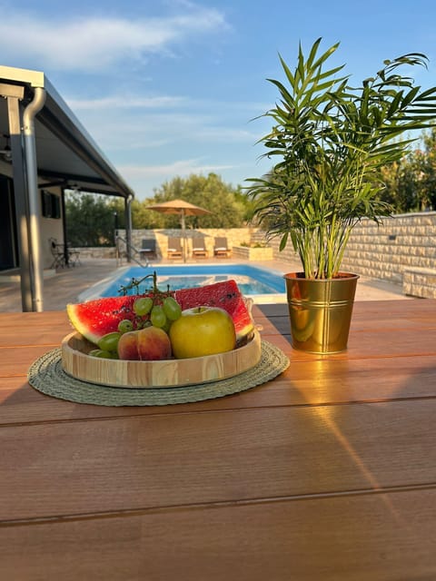 Outdoor pool, a heated pool, open open 24 hours, pool umbrellas