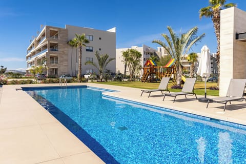Resort-style community swimming pool perfect for relaxing and enjoying the Cabo sunshine.
