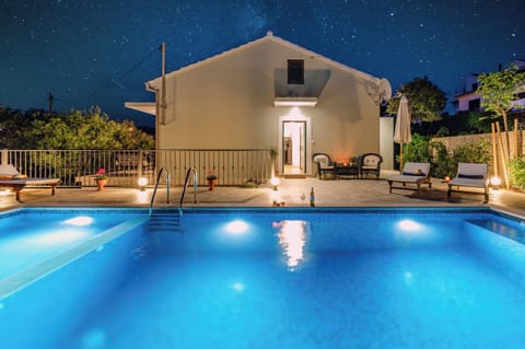 Outdoor pool, a heated pool, sun loungers