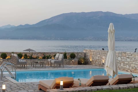 Poolside loungers with uninterrupted coastal views