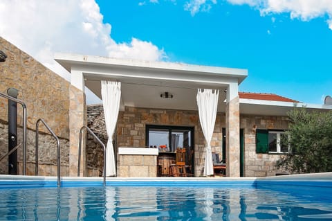 Outdoor pool, a heated pool, open open 24 hours, pool umbrellas