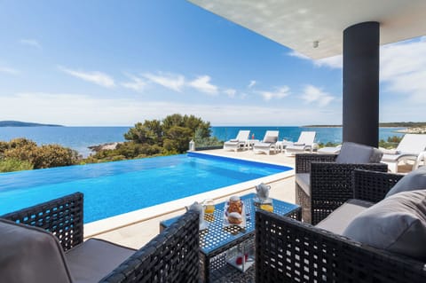 Outdoor pool, an infinity pool, sun loungers