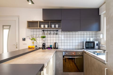 Villa | Private kitchen | Fridge, microwave, oven, stovetop