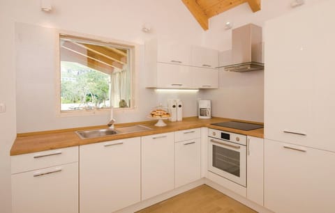 Villa | Private kitchen | Fridge, microwave, oven, stovetop