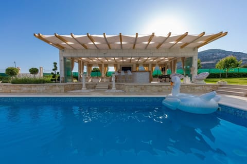 Outdoor pool, a heated pool, pool umbrellas