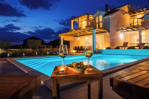 Outdoor pool, a heated pool, open open 24 hours, pool umbrellas