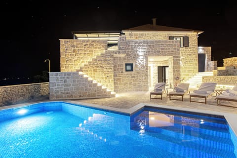 Outdoor pool, a heated pool, open open 24 hours, pool umbrellas